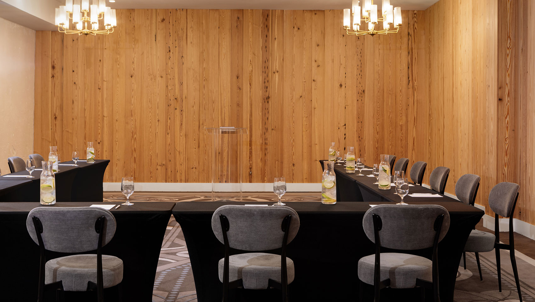 Hotel conference room set up with refreshing spa water at each chair