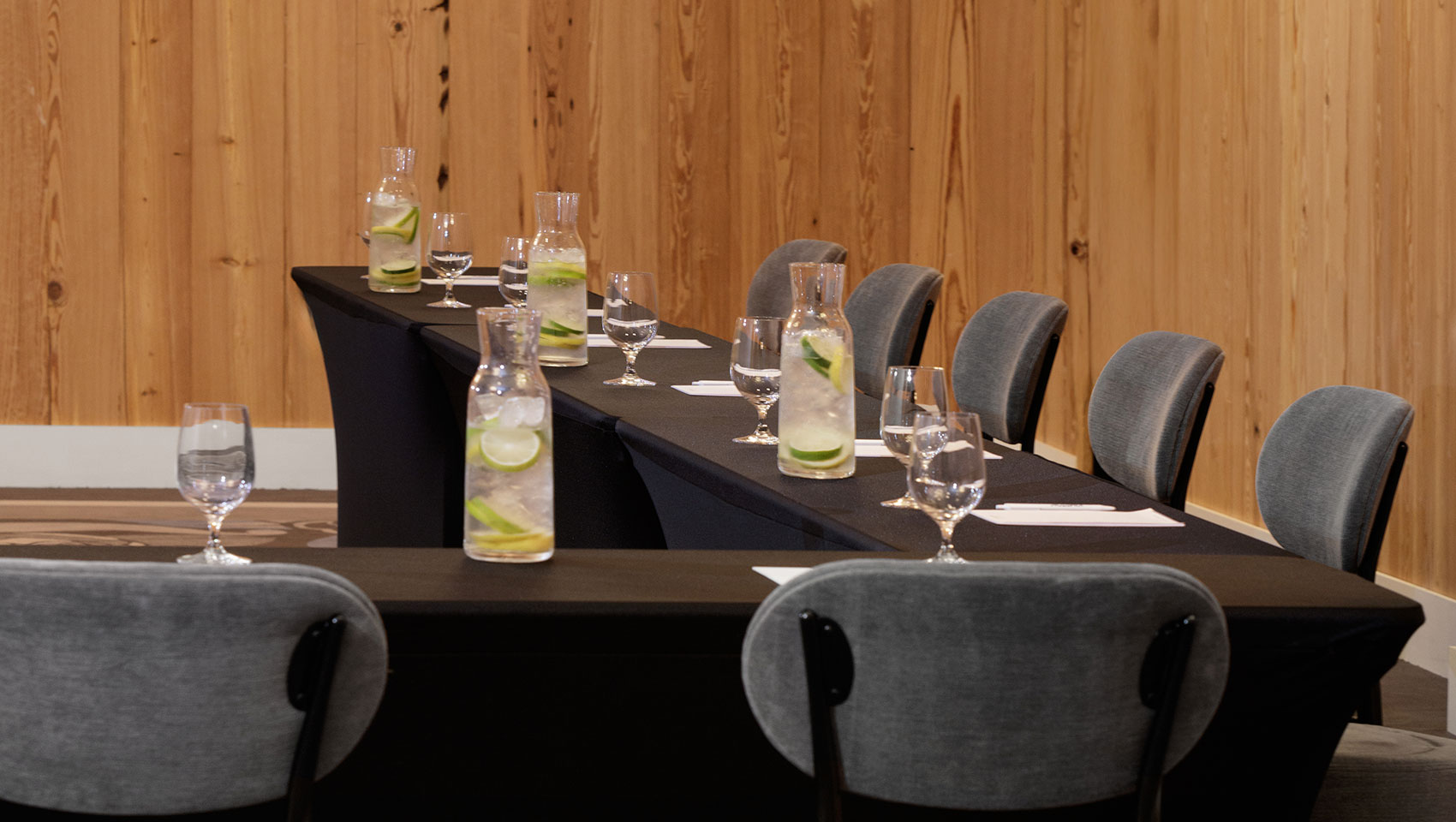 Hotel conference room set up with refreshing spa water at each chair