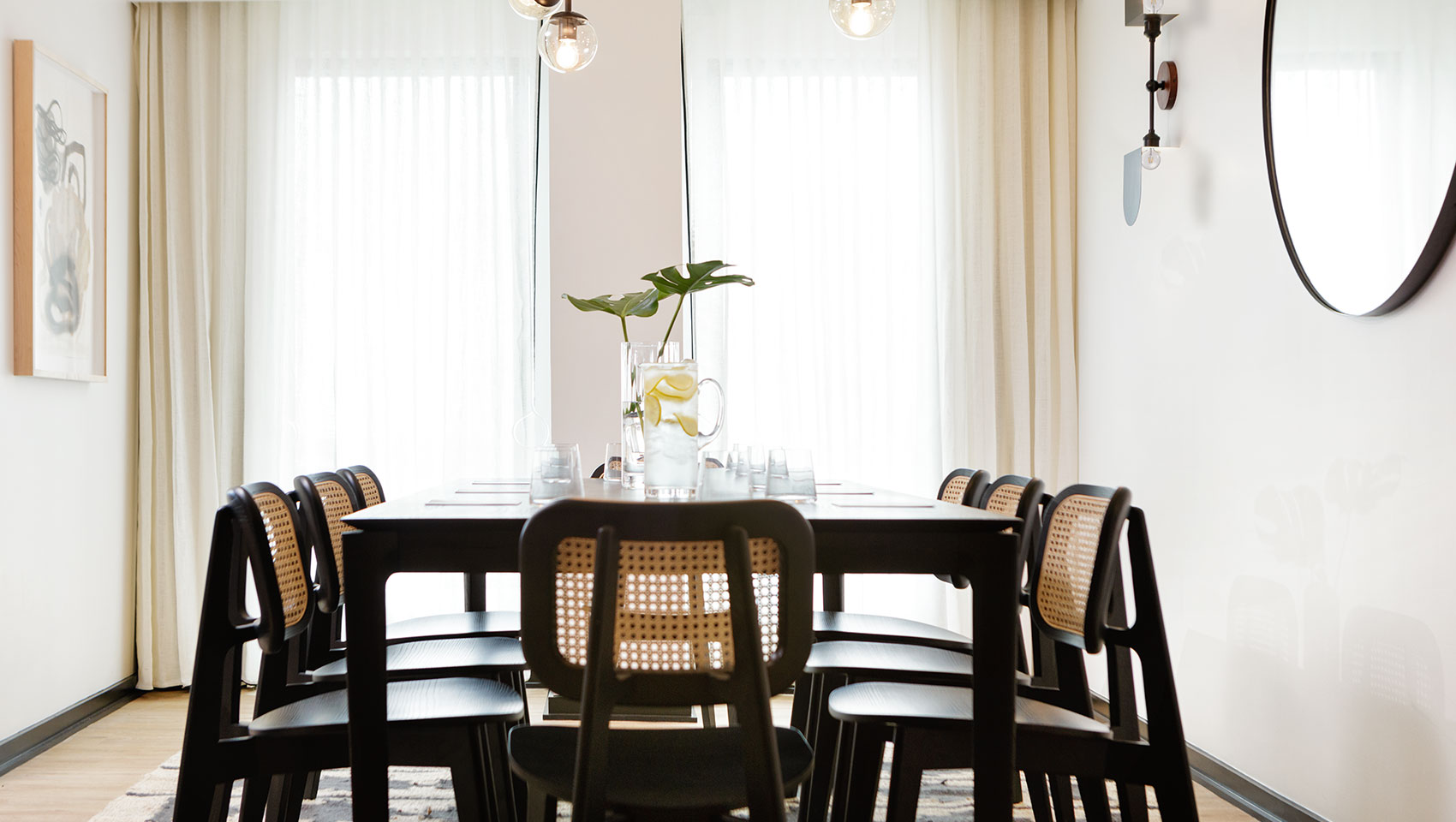 large dining table with chairs and flowers