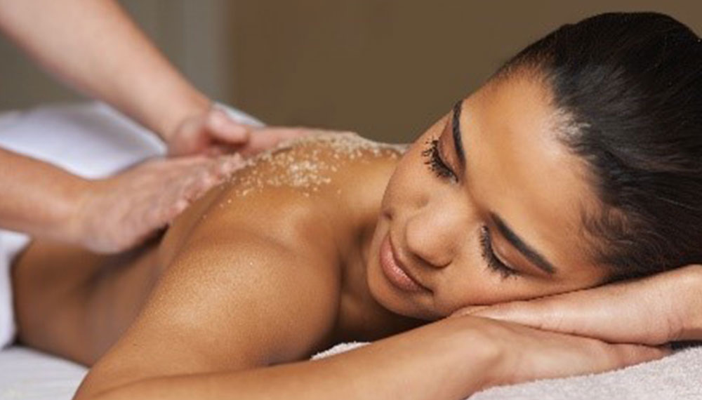 A woman enjoys a massage