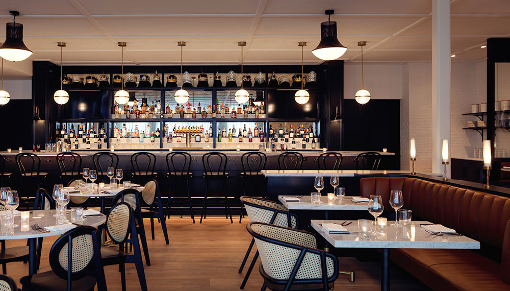 King Brasserie dining area with tables and chairs and bar