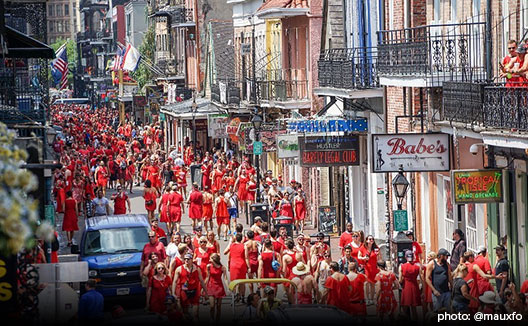 People in red dresses on street